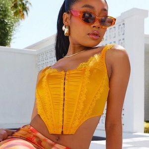 Brand new with tags Fashion Nova corset top in orange.
